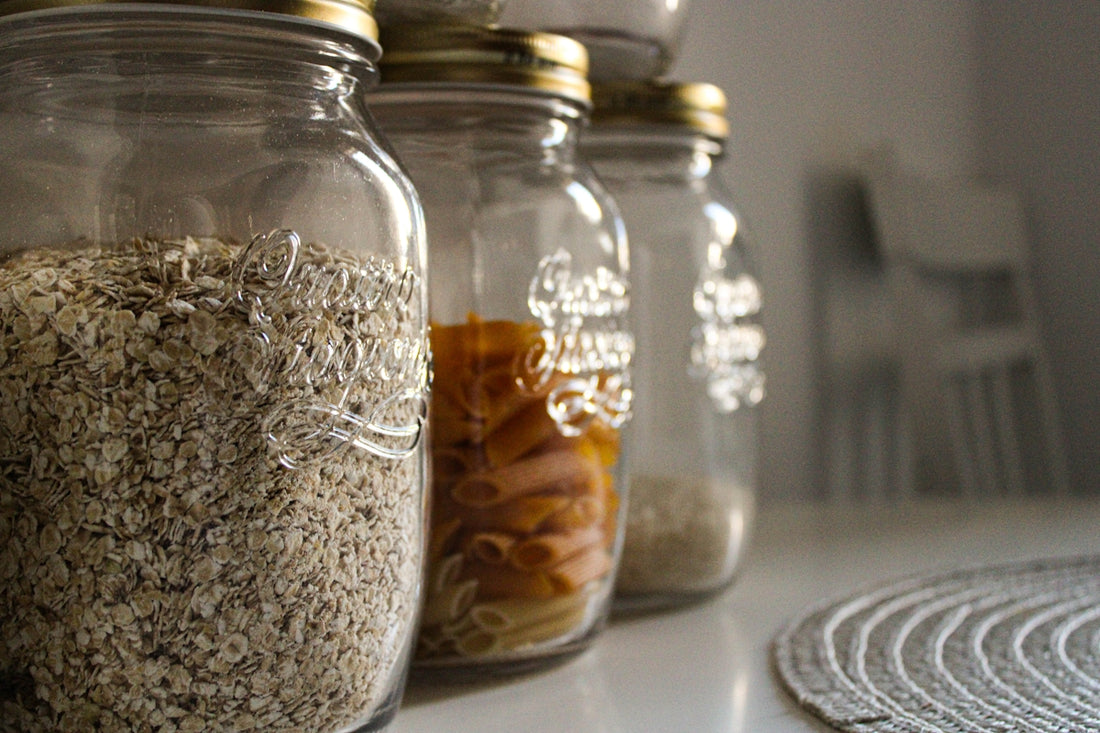 clear glass jar with brown and white beads